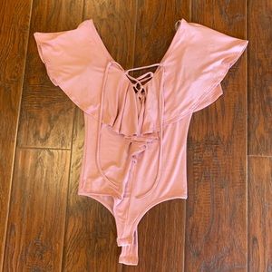 Baby pink body suit